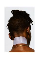 Man wearing ingrown treatment solution after shaving to treat ingrown hairs, razor bumps and irritation on neck.