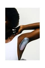 Female with arm up to reveal ingrown hair mask by Flaunt Body for smooth skin free of redness and bumps after shaving underarms.